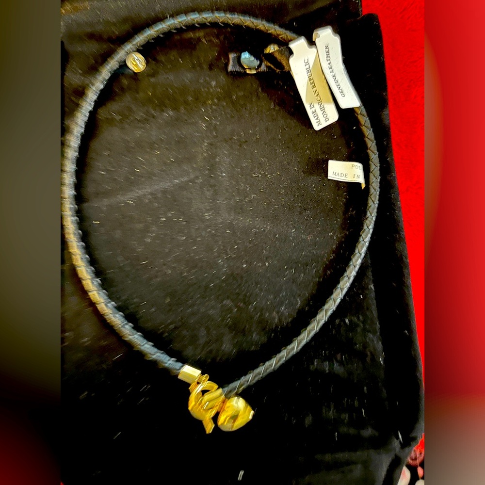 Leather necklace with toggle gold heart charm.
